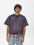 Model in the faded purple cropped tee with its tonal text print