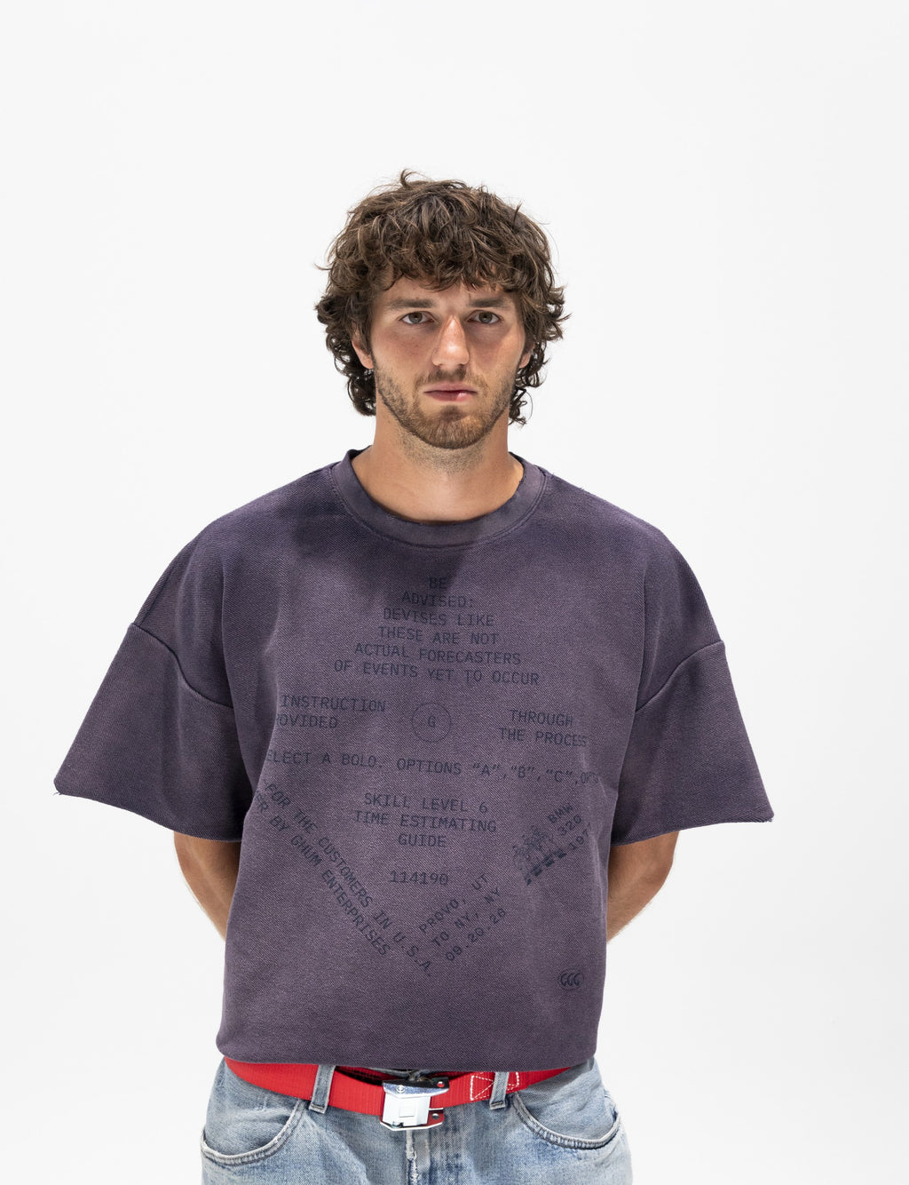 Faded purple cropped fleece tee worn with a red GHUM belt and light jeans